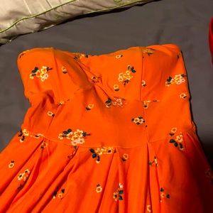 Very soft peachy-orange strapless floral dress